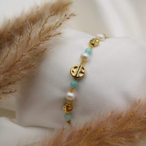 bracelet doré nacré et pierre bleu